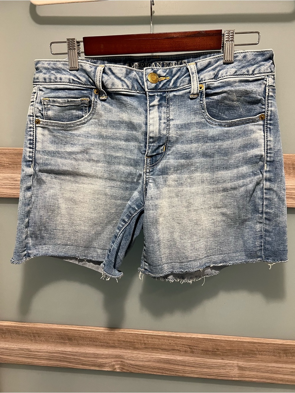 American Eagle | Faded Light Blue Denim Midi Cutoff Shorts